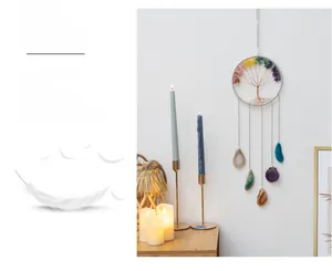 Detail of life tree wall hanging with colorful crystal stones and agate slices décor