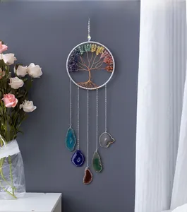 Detail of handmade Tree of Life wall hanging with colorful crystals and agate slices