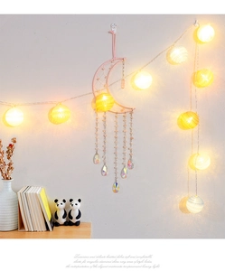 Pink quartz moon dreamcatcher with crystal droplets and warm cotton ball fairy lights