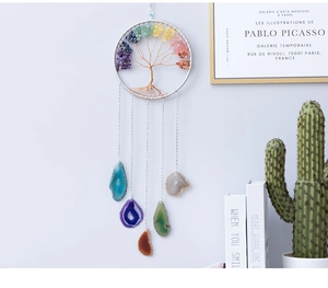 Detail of life tree dream catcher with colorful gemstones and polished agate slices