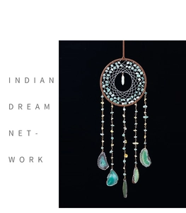 Detail of Indian dream catcher with natural agate slices and turquoise beads hanging