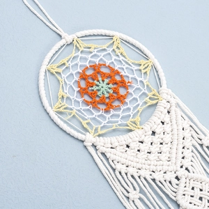 Handmade bohemian crochet wall hanging with colorful geometric mesh and cotton weaving