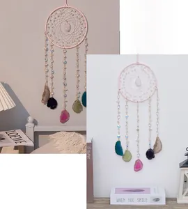 Detail of pink crystal dream catcher featuring colorful agate slices and beads