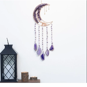 Macro detail of moon-shaped amethyst life tree wall hanging with purple agate slices