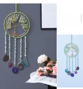 Detail of handmade Tree of Life wall hanging with green crystals and agate slices