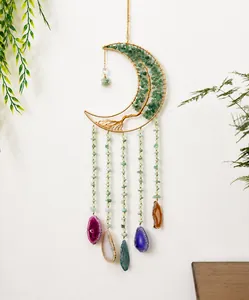 Detail of moon-shaped dream catcher with tree of life green aventurine and agate slices