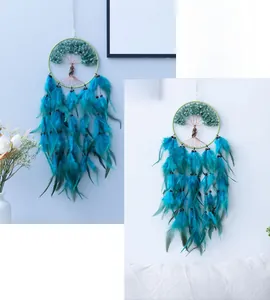 Detail of Tree of Life dream catcher with green stones and sky blue hanging feathers