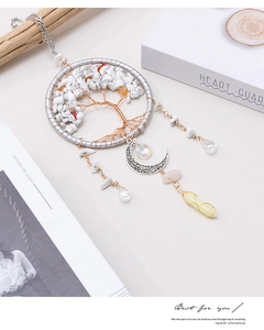 Detail of tree of life suncatcher with white crystals and hanging moon pendant