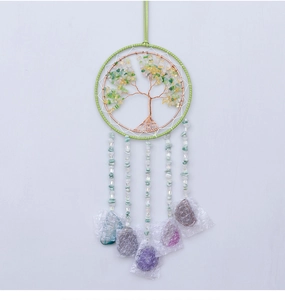Detail of handmade Tree of Life wall hanging with green crystals and gemstone tassels