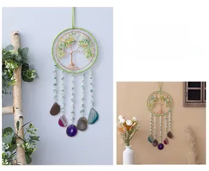 Detail of life tree wall hanging with multi-color agate slices and copper wire wrapping