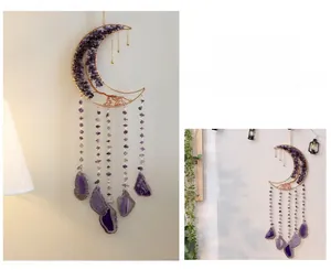 Detailed shot of amethyst tree of life moon pendant with hanging purple agate slices