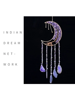 Macro detail of crescent moon dream catcher with tree of life and purple amethyst stones