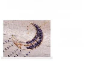 Detail of amethyst moon tree of life pendant featuring intricate gold wire weaving art