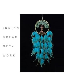 Detail of Tree of Life dreamcatcher with green aventurine crystals and blue feathers