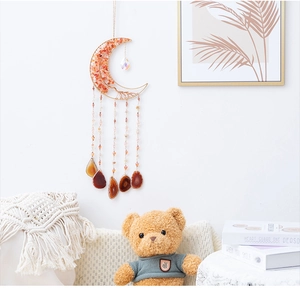 Moon-shaped suncatcher with orange crystal tree of life and brown agate slices for home decor