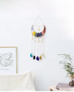 Detailed handmade moon-shaped tree of life wall decor with colorful chakra crystals