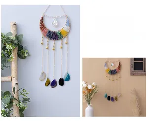 Detail of crescent moon Tree of Life dreamcatcher with colorful stones and agate slices