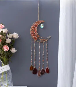 Detail of tree of life suncatcher with orange crystals and hanging agate slices