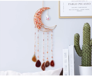 Bohemian moon suncatcher with orange stones and tree of life hanging in home setting