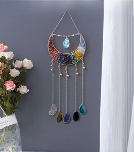 Detailed moon-shaped crystal wall hanging with colorful stones and hanging agate slices