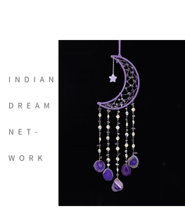 Detail of purple amethyst moon dream catcher with crystal beads and agate slices