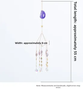 Detail of crystal suncatcher featuring purple agate stone and golden geometric frame