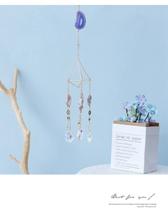 Detailed suncatcher with purple agate slices and geometric golden frames with crystal prisms