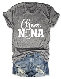 Flat lay of gray Cheer NANA t-shirt with blue ripped denim shorts for summer