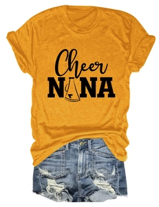 Detail of yellow round neck T-shirt with black logo print and denim shorts outfit