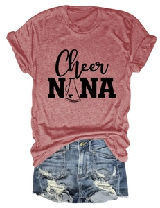 Detailed flat lay of a brick red short sleeve T-shirt with denim shorts and logo graphic