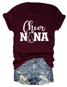 Flat lay of wine red crew neck T-shirt with Cheer NANA print and ripped denim shorts