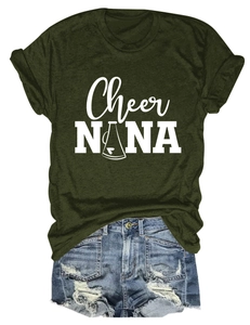 Detail of army green crewneck t-shirt with white graphic and distressed denim shorts