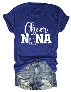 Flat lay of navy blue crew neck t-shirt with white graphic and distressed denim shorts