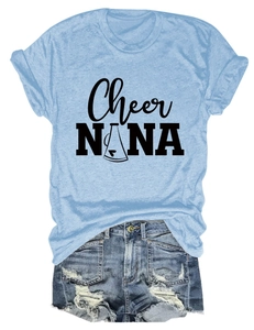 Flat lay of light blue round neck T-shirt with 'Cheer NANA' print and ripped denim shorts