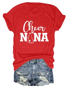 Detail of red crew neck cotton T-shirt with white graphic print and distressed denim shorts
