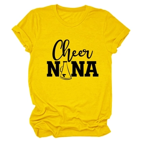 Macro shot of Cheer NANA typography and megaphone graphic on yellow cotton T-shirt