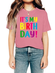 Detail of pink cotton t-shirt with It's My Birthday print paired with blue denim jeans