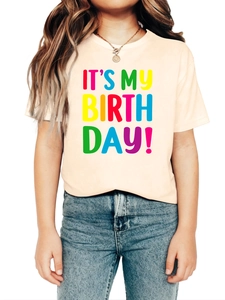 Close-up of kids birthday t-shirt with colorful it's my birth day rainbow print detail