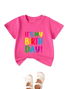 Detail of pink cotton birthday t-shirt featuring IT'S MY BIRTH DAY colorful text print