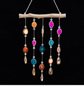 Macro detail of natural agate slices with vibrant colors on a bohemian wind chime