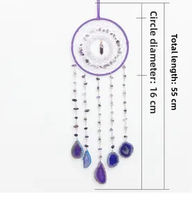 Detail view of purple agate slices and crystal dreamcatcher with hanging stones