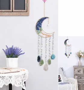 Detail of moon dreamcatcher with turquoise crystals and natural agate slices wall decor