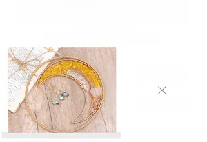 Handmade moon-shaped dream catcher with tree of life crystals and hanging pendants