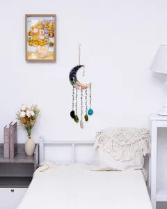 Bohemian moon dream catcher wall decor with crystal stones in a cozy bedroom setting