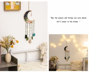 Detail of moon dreamcatcher with agate slices and colorful raw crystals for home decor