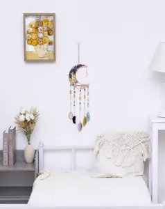 Bohemian moon-shaped dreamcatcher with colorful crystal stones and agate slice pendants