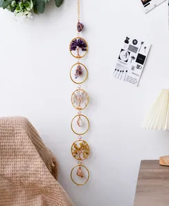 Detail of handmade Tree of Life hanging suncatcher with natural crystal stones