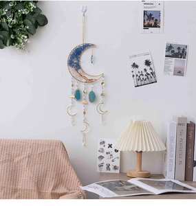Detail of moon-shaped life tree wall hanging with blue agate and crystal pendants