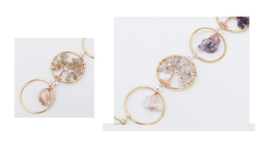 Detailed wire-wrapped Tree of Life suncatcher featuring natural amethyst and crystal stones