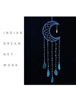 Detail of blue crescent moon dream catcher with agate slices and feathered crystal chains